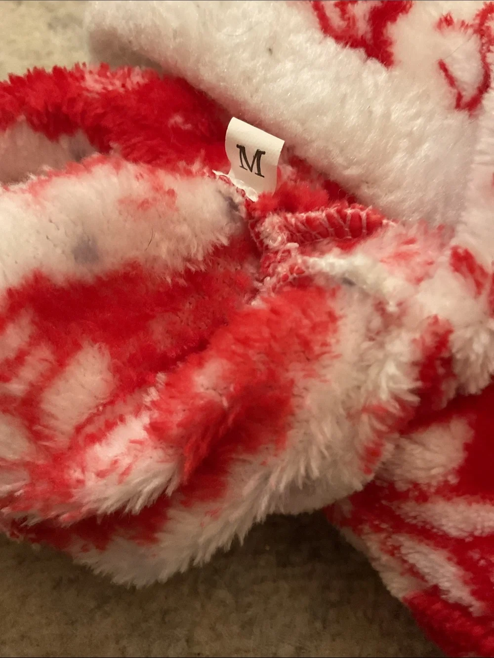 red-and-white fleece reindeer and snowflake dog jumper